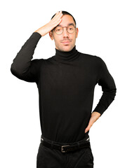 Concerned young man with a stress gesture