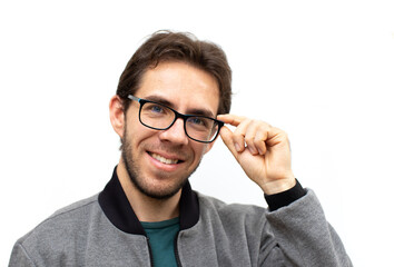 young man guy showing off his new glasses from an optician's shop isolated on white background