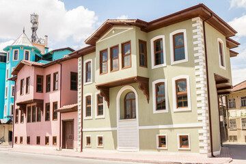 Fototapeta na wymiar Colored houses in the old quarter of Konya. Traditional Turkish houses, July 2022