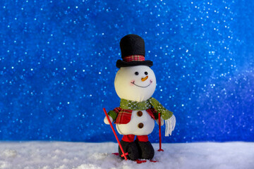 Naklejka na ściany i meble Happy snowman standing in winter sparkling christmas landscape. Merry christmas and happy new year greeting card with copy space .Snow background.