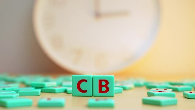 The word CBD made of small colorful game board pieces with letters imprinted on them. Cannabis as herbal alternative medicine and chemical therapy. High quality 4k footage
