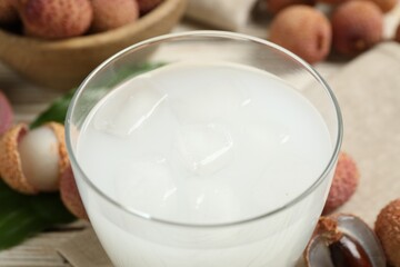 Freshly made lychee juice on table, closeup