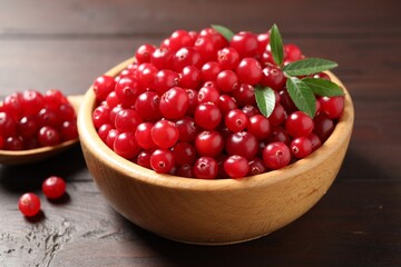 Fresh ripe cranberry on wooden table, closeup