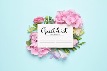 Beautiful flowers and guest list on light blue background, flat lay