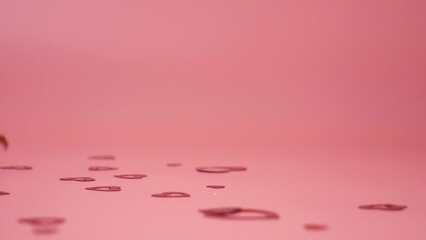 falling red hearts on a pink background, love story Valentine Day. High quality FullHD footage