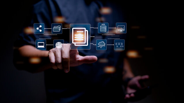 Businessman using a computer to document management concept, online documentation database and digital file storage system software, records keeping, database technology, file access, doc sharing.