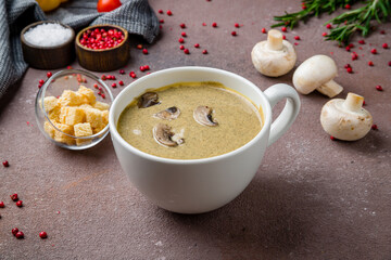Cream soup of mushrooms on brown table