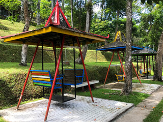 An Empty Swing with canopy in the park