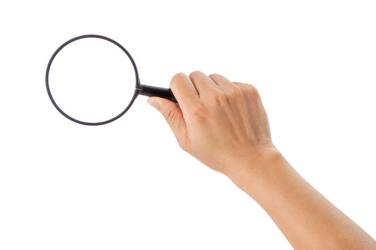 a hand holding a magnifying glass.