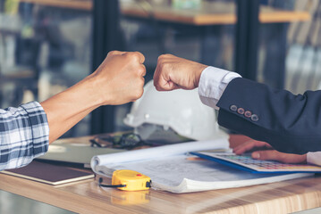 Two Men team fist bump Business Partner Businessman Trust Teamwork Partnership Industry contractor dealing mission business. Mission Business team meeting group of People Fist bump Hands together