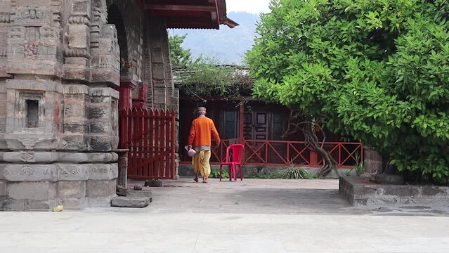 4k video of krishna muralidhar temple in naggar, himachal prdesh, india. the himchali hindu priest roaming around.
