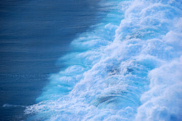 Blue sea marine ocean seascape tropical huge wave on blurred background. Seascape blue ocean white wave motion outdoor. Aqua marine huge wave sea summer background. Paradise turquoise water landscape