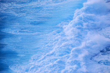 Blue sea marine ocean seascape tropical huge wave on blurred background. Seascape blue ocean white wave motion outdoor. Aqua marine huge wave sea summer background. Paradise turquoise water landscape