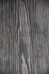 vertical close up of weathered pine board with detailed grain and smudges, dirty