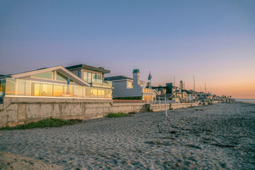 La Jolla, California- Row of beach houses near the sandy seashore during sunset