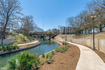 Downtown San Antonio, Texas- Two concrete walkways on both sides of the river