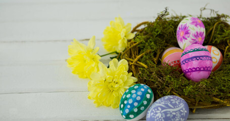 Obraz na płótnie Canvas Image of colourful easter eggs in nest