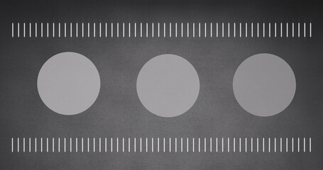 Image of moving white lines and circles on grey background
