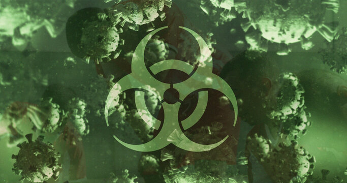 Image of virus cells floating and biohazard symbol over group of football players - Powered by Adobe