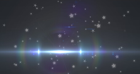 Obraz premium Image of glowing blue light moving over stars in background