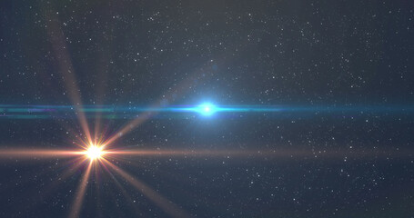 Fototapeta premium Image of glowing blue and orange light moving over spots of light and stars in background