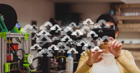 Fototapeta na wymiar Composite image of multiple cloud icons against caucasian woman wearing vr headset