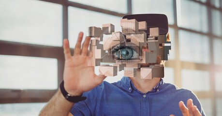 Composite image of eye retina biometric scanner against caucasian man wearing vr headset