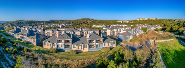 Austin, Texas- Panoramic view of adjacent houses against the clear blue sky