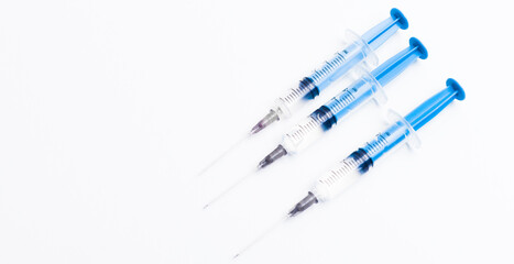 Medical syringe on a white background. A syringe for injection. The concept of health and beauty