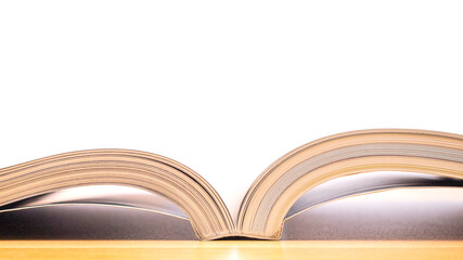 Open book on white background.