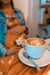 Pregnant woman coffee drink. Lifestyle morning with happy pregnancy girl drink espresso coffee. Represent breakfast, energy, freshness or great aroma concept.