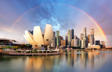 Fototapeta na wymiar Singapore city with rainbow in Marina during dramatic sunset