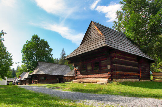 Summer view of wooden folk house located in forests  museum Skanzen of Orava Village, Zuberec, Slovakia. Orava Skanzen