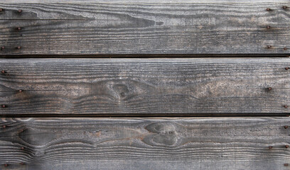 Planche de bois usé sur une terrasse en bois.