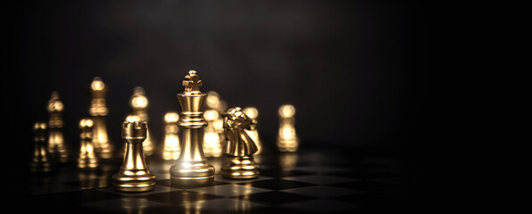 King chess stand on chessboard concept of challenge or team player or business team and leadership...