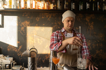 Barman at work, preparing cocktails. concept about service and beverages.