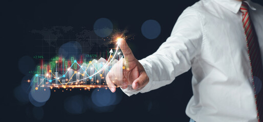 Businessman touching the virtual screen to high growth graph. The planning strategy of marketing for business future growth with copy space. business, investment, finance, and accounting concepts.