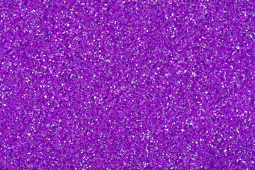 Perfect glitter background in your adorable violet tone, Christmas, xmas texture for your mood. New Year holiday seasonal wallpaper decoration in gold color, greeting and winter design element.