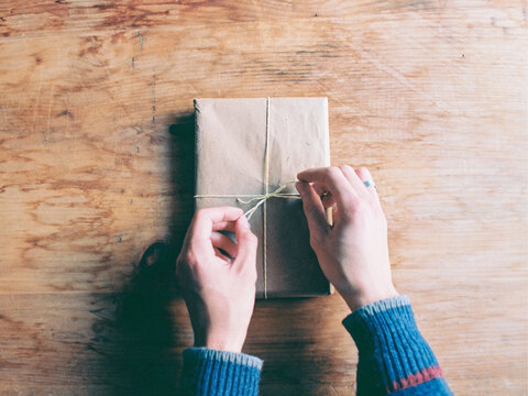 person wrapping package