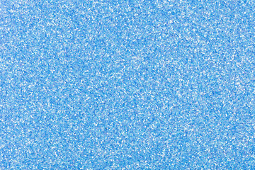 Fototapeta na wymiar Glitter texture in gentle blue tone for Christmas individual creative design work. Sparkling shiny wrapping paper for New Year holiday seasonal wallpaper decoration, greeting, winter design element.