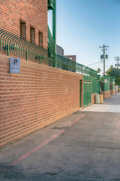 Wall fence bricks with No Parking sign on fire lane at Phoenix, Arizona