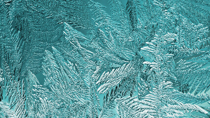 Abstract Christmas background. Ice crystals on frozen window glass. Frost drawing. A pattern of leaves and stems of magical fantastic plants. Turquoise tinted winter wallpaper. Cold and crystal. Macro