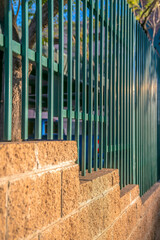 Close-up of a concrete block wall with painted green railings- Phoenix, Arizona