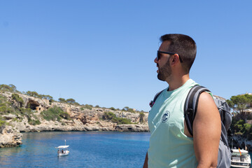 Young male tourist in Cala Figuera, Mallorca.