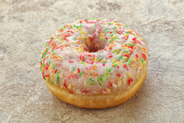 Sweet glazed vanilla donut with icing