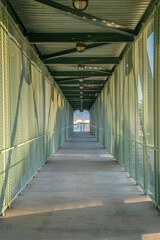 Footbridge with concrete walkway and metal walls and roof- Phoenix, Arizona
