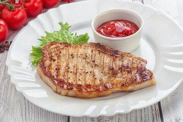 Grilled pork steak with ketchup