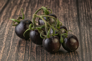 Ripe tasty black cherry tomato
