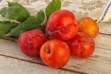 Red juicy raw plum heap