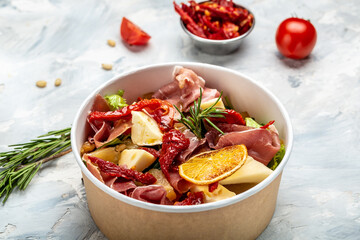 Healthy salad with Prosciutto, ham and grapefruit jamon, salad mix, grapefruit, cherry tomatoes,...